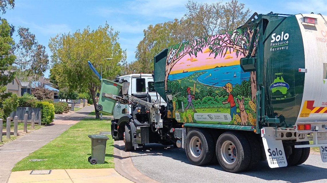 Rubbish truck emptying bins