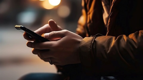 Person gambling on mobile phone.jpg