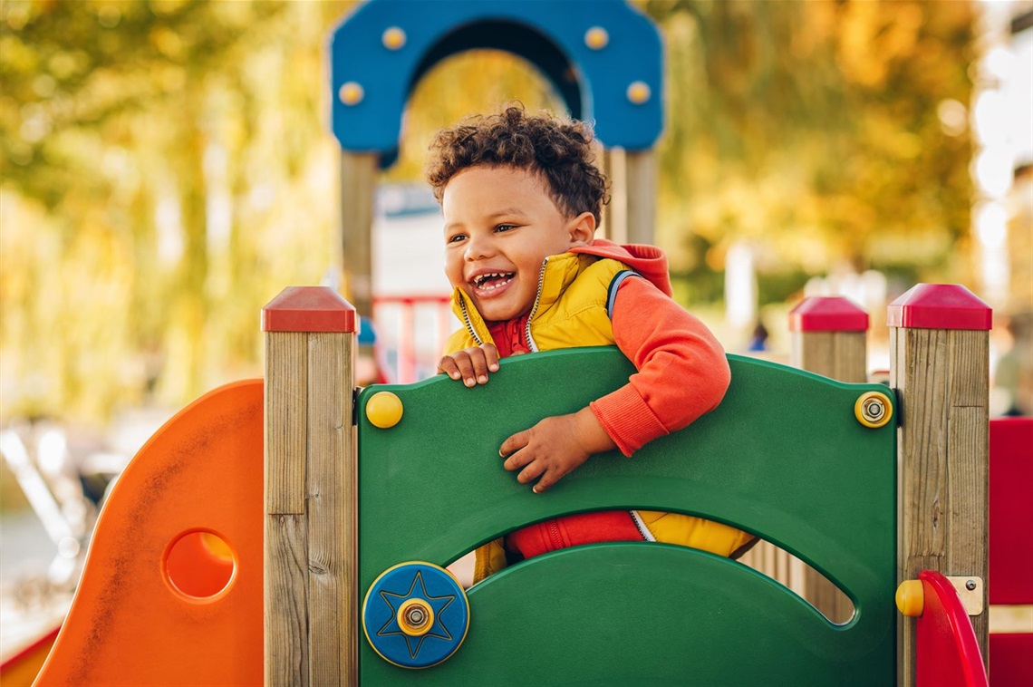 Child-playing-on-playground-equipment-David-MacFarlan-Compact-Playground.jpeg