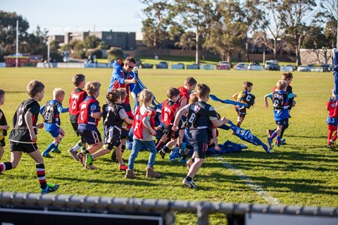 Children playing local sport on field.jpg