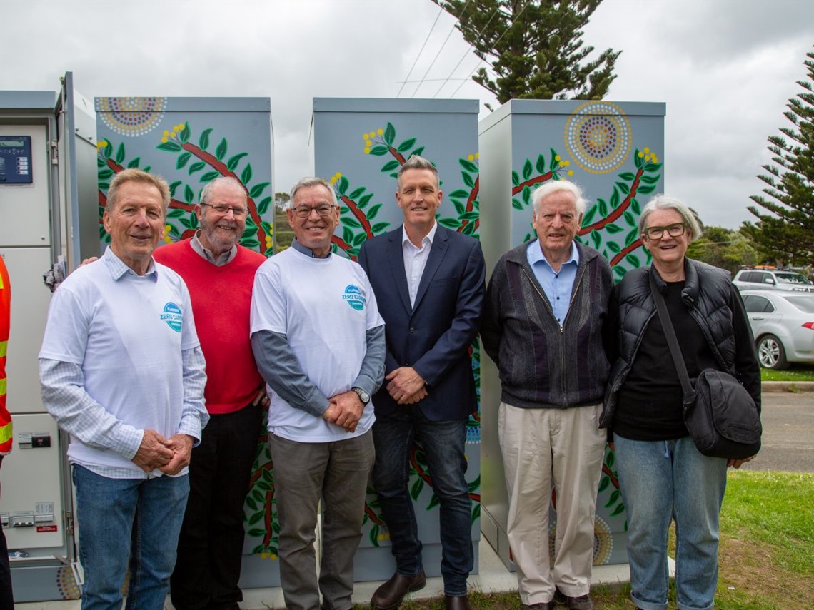 Flinders community battery and six people.jpg